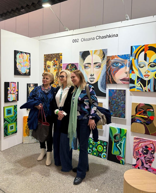 Visitors posing in front of Oksana Chashkina’s artwork at The Other Art Fair Sydney.