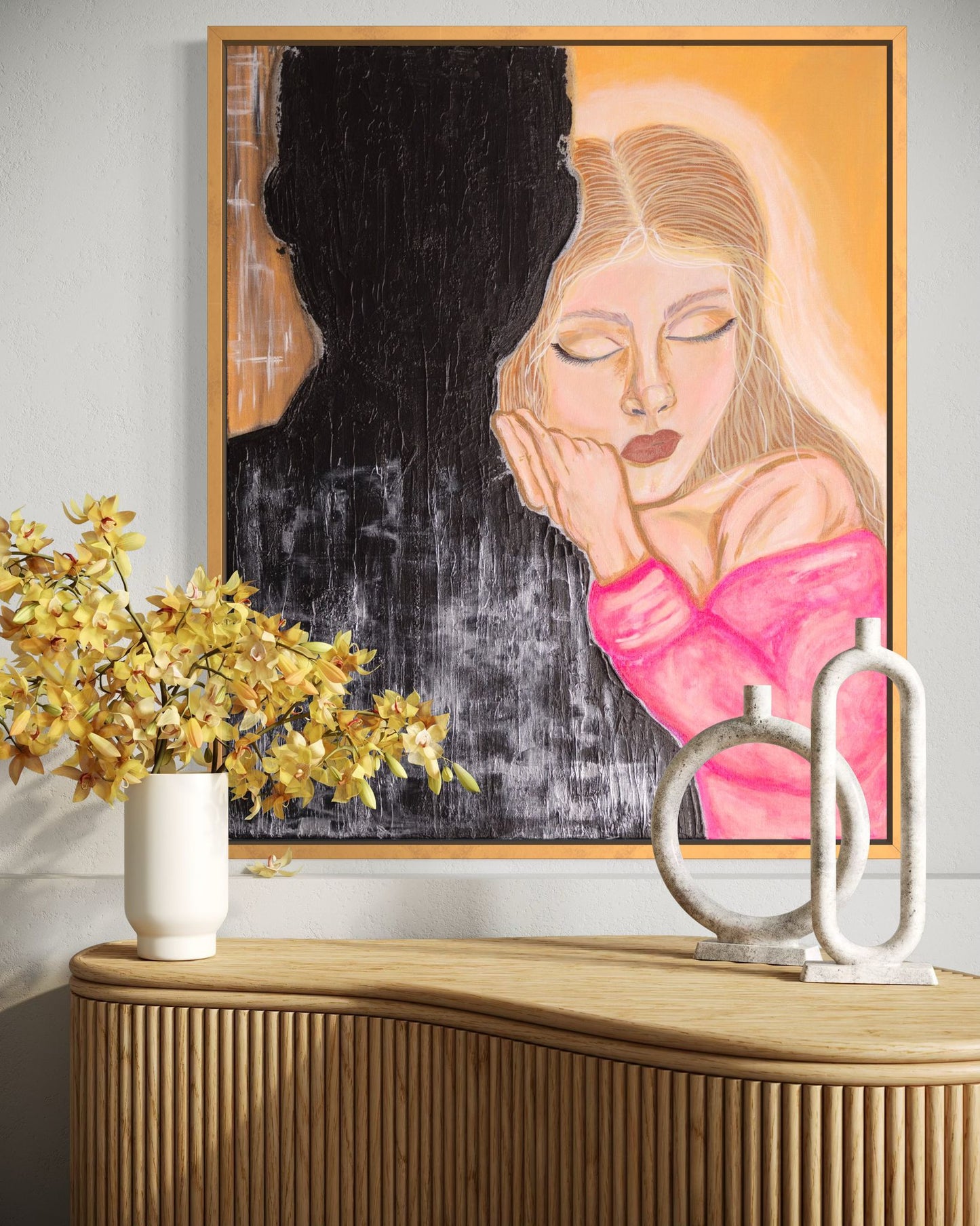 Painting Awaken by Oksana Chashkina hanging above a curved wooden sideboard, paired with a white vase of yellow flowers and sculptural ceramic decor in a warm contemporary room.